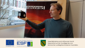 Dr. Markus Bergmann holding a sensor